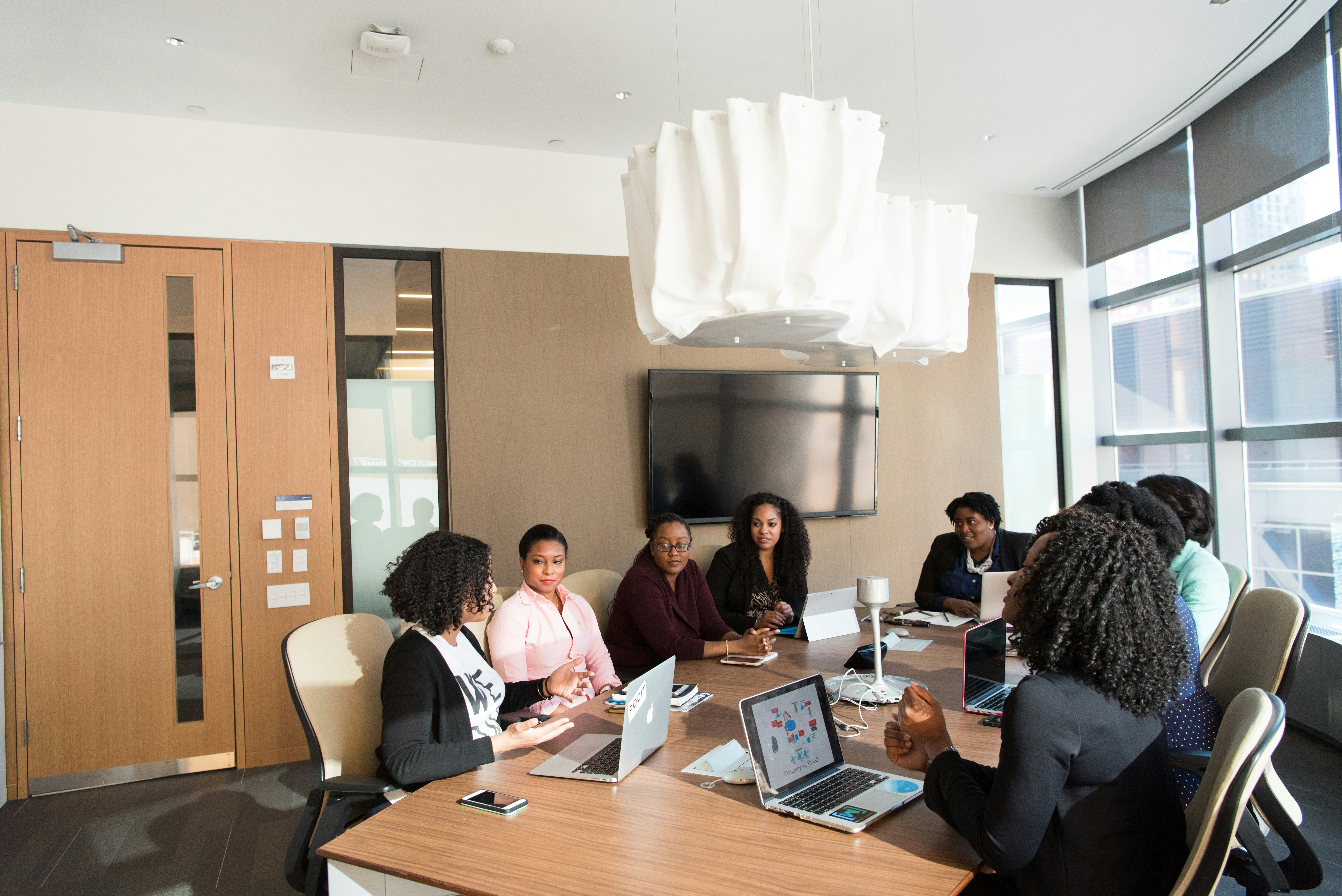 Professional team collaborating in a modern boardroom meeting